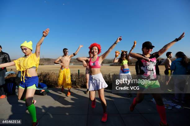 Participants pose during 6th The Pig Run at Olympic Forest Park on February 26, 2017 in Beijing, China.