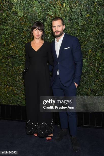 Jamie Dornan and Amelia Warner attend Charles Finch and CHANEL Pre-Oscar Awards Dinner at Madeo Restaurant on February 25, 2017 in Los Angeles,...