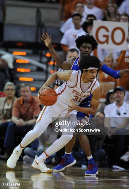 Texas Longhorns forward Jarret Allen drives past Kansas Jayhawks guard Josh Jackson during game between the Texas Longhorns and the Kansas Jayhawks...