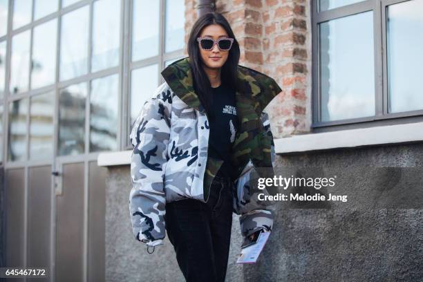 Justine Lee wears a camoflage Canada Goose x Vetements puffer jacket outside Missoni during Milan Fashion Week Fall/Winter 2017/18 on February 25,...