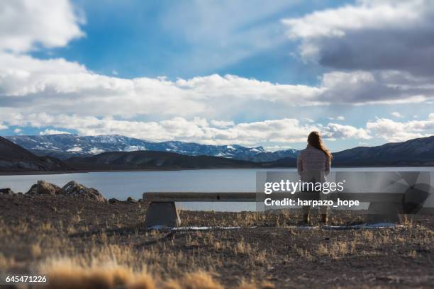 woman in a peaceful thinking spot - harpazo hope stock pictures, royalty-free photos & images