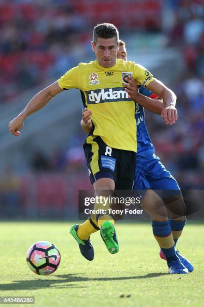 Nick Montgomery of the Mariners contests the ball with Andrew Nabbout of the Jets during the round 21 A-League match between the Newcastle Jets and...