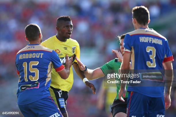 Kwabena Appiah-Kubi of the Mariners confronts Jets players during the round 21 A-League match between the Newcastle Jets and the Central Coast...
