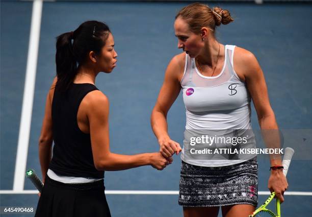 Taiwanese Su-Wei Hsieh and Georgian Oksana Kalashnikova celebrate their point against Australian Arina Rodionova and Kazakh Galina Voskoboeva during...