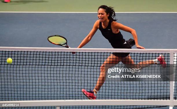 Taiwanese Su-Wei Hsieh plays a ball during her match with her partner Georgian Oksana Kalashnikova against Kazakhstan's Galina Voskoboeva and...