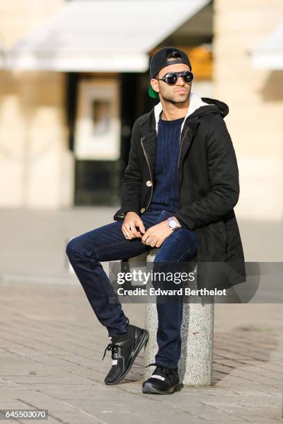 Anil Brancaleoni, Youtube influencer known as Wartek and blogger, wears Puma black shoes, Replay black denim jeans pants, a Gant blue pull over, a...