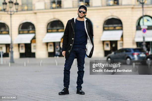 Anil Brancaleoni, Youtube influencer known as Wartek and blogger, wears Puma black shoes, Replay black denim jeans pants, a Gant blue pull over, a...
