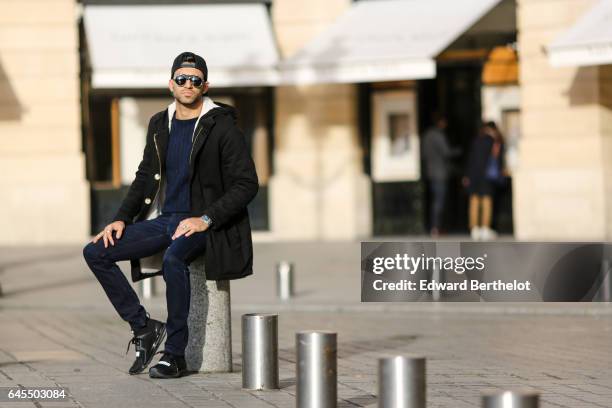 Anil Brancaleoni, Youtube influencer known as Wartek and blogger, wears Puma black shoes, Replay black denim jeans pants, a Gant blue pull over, a...