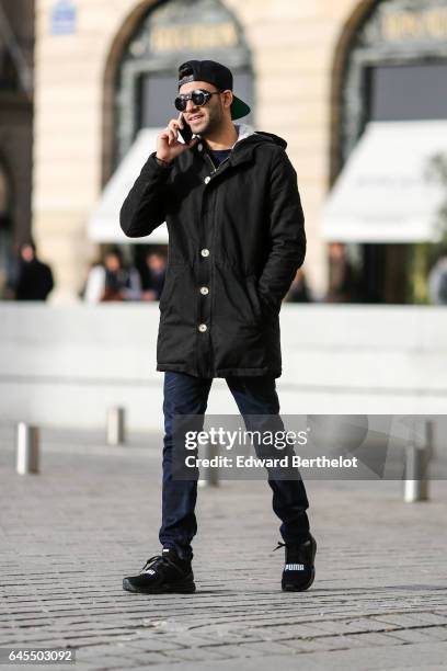 Anil Brancaleoni, Youtube influencer known as Wartek and blogger, wears Puma black shoes, Replay black denim jeans pants, a Gant blue pull over, a...