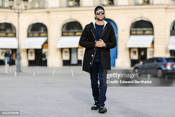 Anil Brancaleoni, Youtube influencer known as Wartek and blogger, wears Puma black shoes, Replay black denim jeans pants, a Gant blue pull over, a...