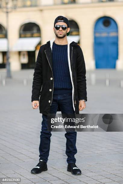 Anil Brancaleoni, Youtube influencer known as Wartek and blogger, wears Puma black shoes, Replay black denim jeans pants, a Gant blue pull over, a...