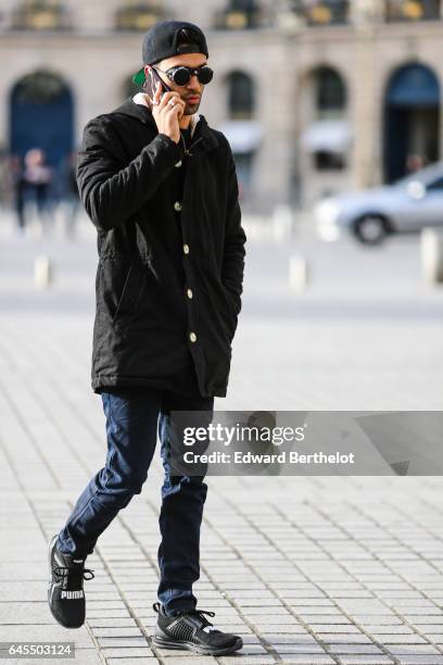 Anil Brancaleoni, Youtube influencer known as Wartek and blogger, wears Puma black shoes, Replay black denim jeans pants, a Gant blue pull over, a...