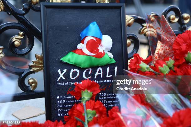 People lay flowers at "Ana feryadi" monument during the 25th anniversary of Khojaly Massacre, in Baku, Azerbaijan on February 26, 2017. The massacre...