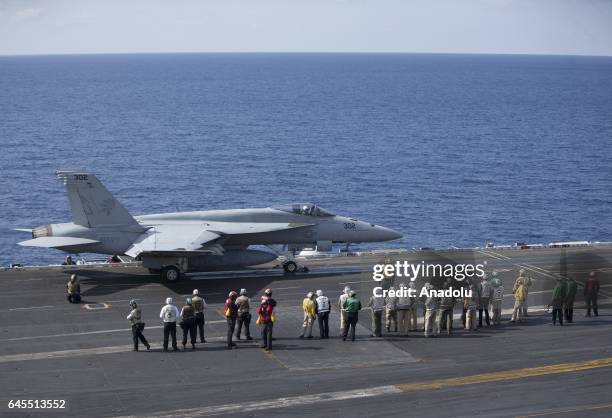 Hornet aircraft is launched off the deck of US aircraft carrier USS George Washington during its mission in the eastern Mediterranean Sea on February...