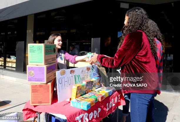 Molly Sheridan age 13, sells Girl Scout cookies in Chicago on February 19, 2017. On a sunny Sunday afternoon, Molly Sheridan is hard at work in front...