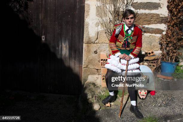 Participant in the masquerade of the felos in the rural carnival of Maceda rests after crossing several streets of the municipality Spain, on 25...