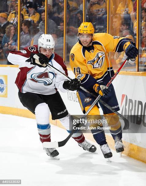 Calle Jarnkrok of the Nashville Predators skates against the Patrick Wiercioch of the Colorado Avalanche during an NHL game at Bridgestone Arena on...