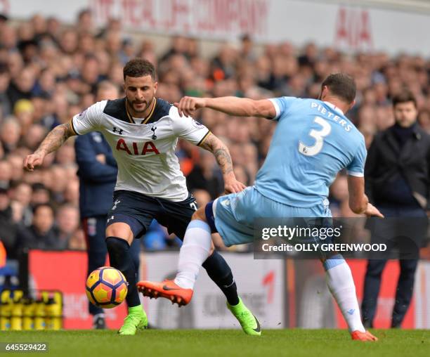 Tottenham Hotspur's English defender Kyle Walker takes on Stoke City's Dutch defender Erik Pieters during the English Premier League football match...