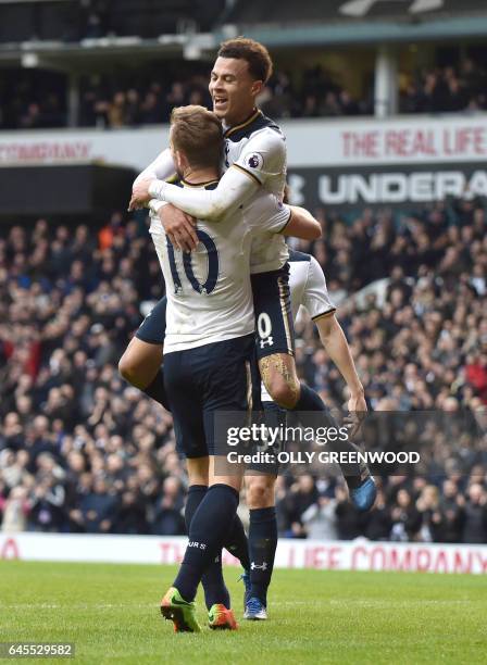 Tottenham Hotspur's English midfielder Dele Alli celebrates with Tottenham Hotspur's English striker Harry Kane after scoring their fourth goal...