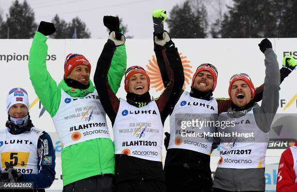 Bjoern Kircheisen, Eric Frenzel, Fabian Riessle and Johannes Rydzek of Germany pose after winning the gold medal in the Men's Nordic Combined Team HS...