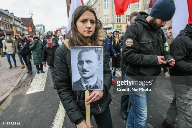 People with Cursed soldiers portraits are seen during the Cursed soldiers Day parade on 26 February 2017 in Gdansk, Poland. The Cursed soldiers were...