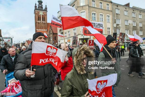 People with Polish flags attending the parade are seen during the Cursed soldiers Day parade on 26 February 2017 in Gdansk, Poland. The Cursed...