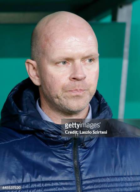 Head coach Henning Berg of Videoton FC watches the beginning of the game during the Hungarian OTP Bank Liga match between Ferencvarosi TC and...