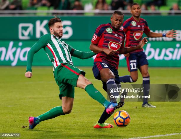 Marco Djuricin of Ferencvarosi TC competes for the ball with Paulo Vinicius of Videoton FC in front of Loic Nego of Videoton FC during the Hungarian...