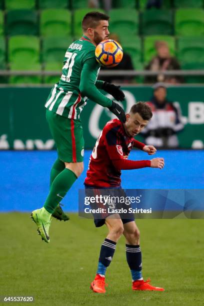 Endre Botka of Ferencvarosi TC competes for the ball with Asmir Suljic of Videoton FC during the Hungarian OTP Bank Liga match between Ferencvarosi...