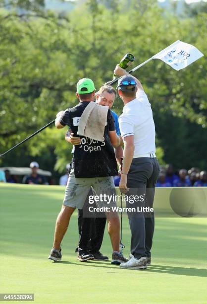 Darren Fichardt of South Africa is congratulated by fellow South African golfer Brandon Stone after winning the Joburg Open at Royal Johannesburg and...