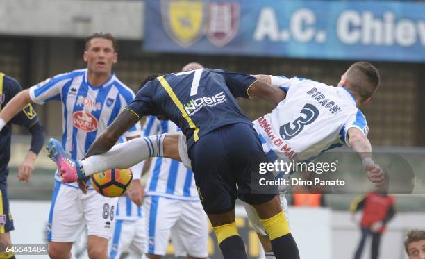 Serge Gakpe' of ChievoVerona competes with Cristiano Biraghi of Pescara Calcio during the Serie A match between AC ChievoVerona and Pescara Calcio at...