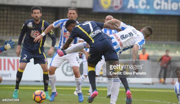 Serge Gakpe' of ChievoVerona competes with Cristiano Biraghi of Pescara Calcio during the Serie A match between AC ChievoVerona and Pescara Calcio at...