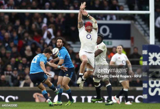 Tommaso Allan of Italy kicks a drop goal as James Haskell of England closes in during the RBS Six Nations match between England and Italy at...
