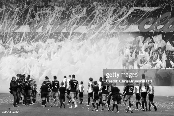 The two teams walk out ahead of the Dutch Eredivisie match between Feyenoord and PSV Eindhoven at De Kuip on February 26, 2017 in Rotterdam,...
