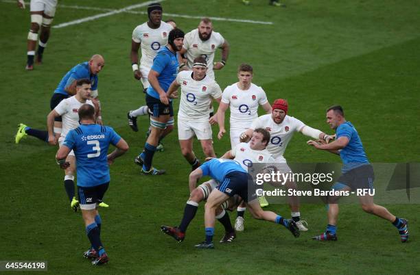 Joe Launchbury of England is tackled by Giorgio Bronzini of Italy during the RBS Six Nations match between England and Italy at Twickenham Stadium on...