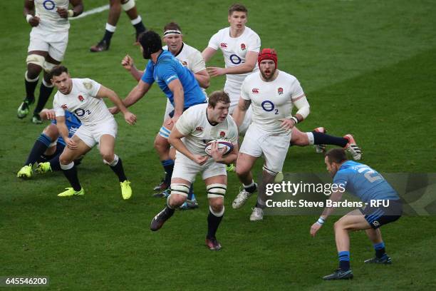 Joe Launchbury of England is tackled by Giorgio Bronzini of Italy during the RBS Six Nations match between England and Italy at Twickenham Stadium on...
