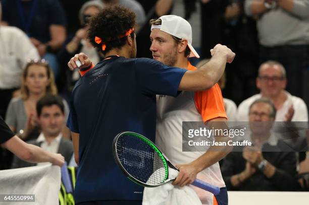 Jo-Wilfried Tsonga of France greets Lucas Pouille of France at the net after beating him in the final of the Open 13, an ATP 250 tennis tournament at...