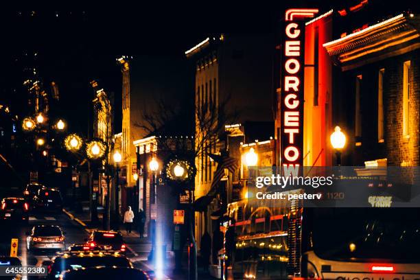 night traffic in georgetown, washinhton dc. - george town stock pictures, royalty-free photos & images