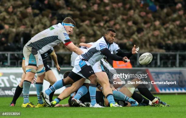 Glasgow Warriors' replacement scrum half Ratu Tagive passes from the base of a ruck during the Guinness Pro12 Round 16 match between Ospreys and...