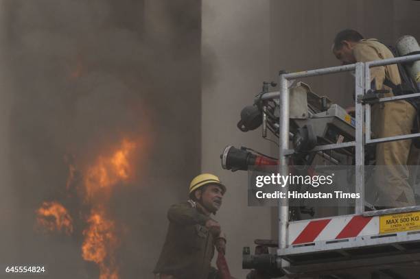 Massive fire breaks out at the Times of India building in Bahadur Shah Zafar Marg, on February 26, 2017 in New Delhi, India. 31 fire tenders were...