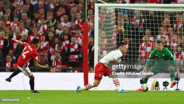 Jesse Lingard of Manchester United shoots past Maya Yoshida and Fraser Forster of Southampton to score their second goal during the EFL Cup Final...