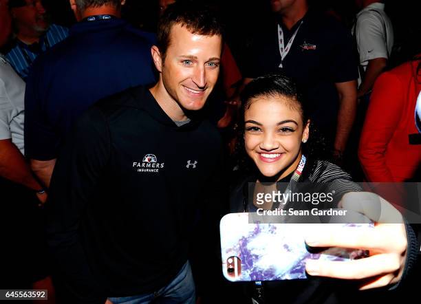 Olympic gold medalist Laurie Hernandez takes a selfie with Kasey Kahne, driver of the Farmers Insurance Chevrolet, prior to the 59th Annual DAYTONA...
