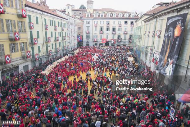 Members of an orange battle team take part in the traditional 'battle of the oranges' held during the Ivrea Carnival on February 26, 2017 in Ivrea,...