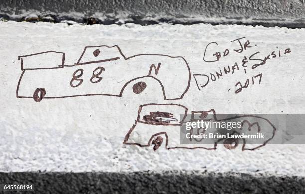 Fan-written note for Dale Earnhardt Jr., driver of the Nationwide Chevrolet, is seen prior to the 59th Annual DAYTONA 500 at Daytona International...