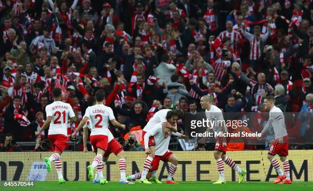 Manolo Gabbiadini of Southampton celebrates with team mates and fans as he scores their second goal during the EFL Cup Final match between Manchester...