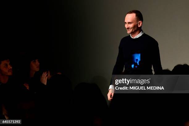 Designer Fulvio Rigoni greets the audience at the end of the show for fashion house Salvatore Ferragamo during the Women's Fall/Winter 2017/2018...