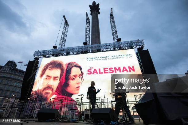 The poster for Iranian film The Salesman is displayed on a screen during a free screening and UK premier of the film in Trafalgar Square on February...