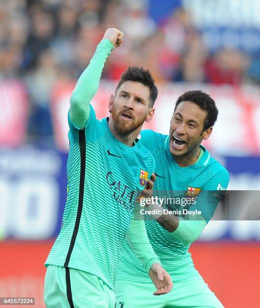 Lionel Messi of FC Barcelona celebratea with Neymar after scoring his 2nd goal during the La Liga match between Club Atletico de Madrid and FC...