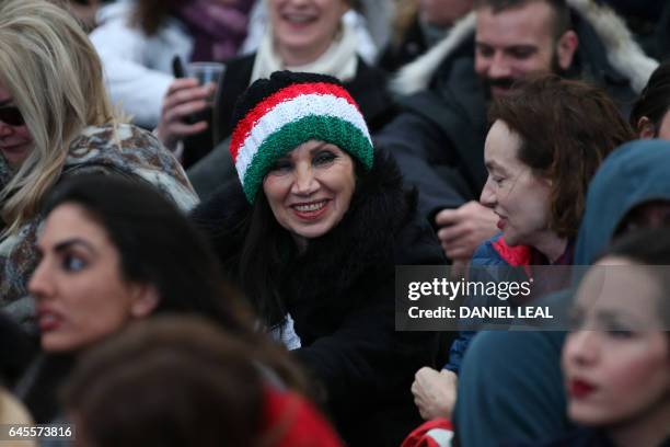 Woman wears a hat with the colours of the Iranian flag as people gather in Trafalgar Square for the public screening for the film 'The Salesman' in...