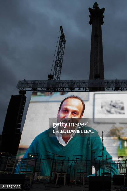 Iranian filmmaker Asghar Farhadi speaks in a recorded video message during the public screening for the film 'The Salesman' in Trafalgar Square in...